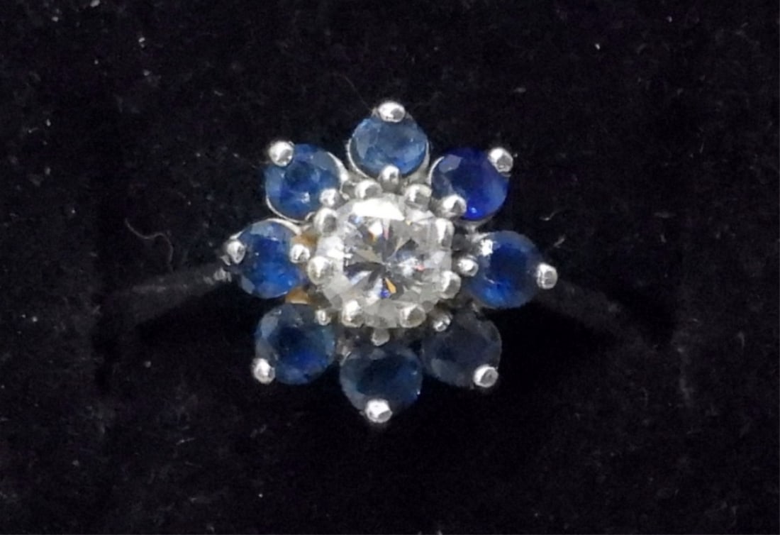 14K WHITE GOLD 1/2 CT DIAMOND & SAPPHIRE RING: 14K WHITE GOLD, 1/2 CARAT DIAMOND WITH SAPPHIRES SURROUNDING IT. (DIAMOND WAS TESTED, SAPPHIRES WERE NOT). SIZE 6. GORGEOUS RING! (1.9 DWT WITH STONES).