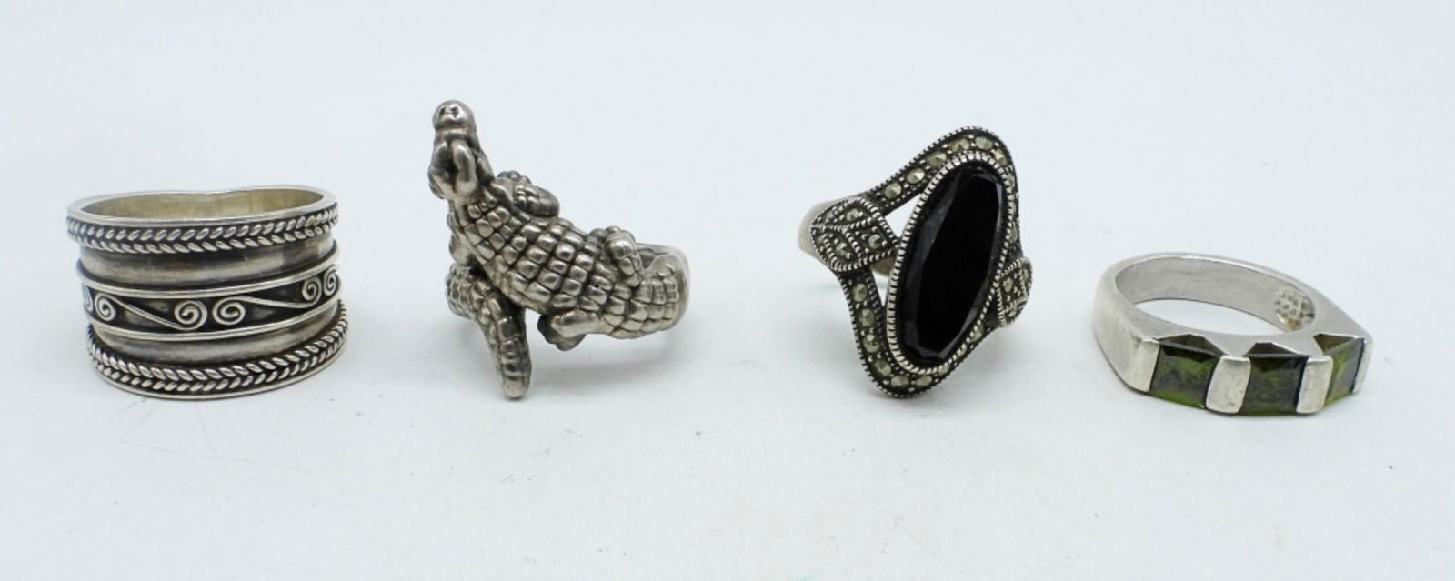 FOUR STERLING FASHION RINGS (1 of 4)