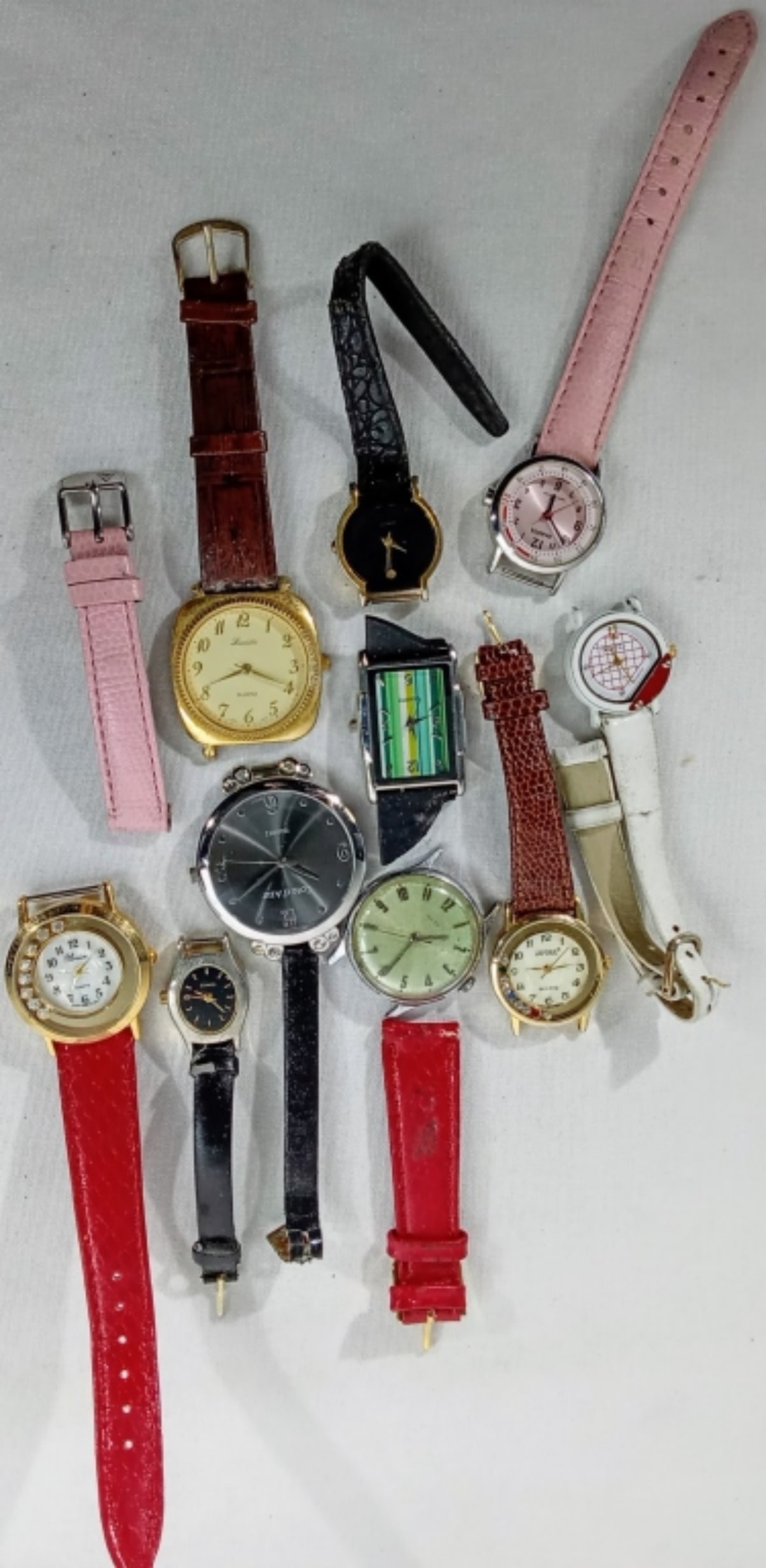 (10) MIXED LOTS LADIES BROKEN BANDS: WATCHES ARE NOT VERIFIED, AUTHENTICATED, OR TESTED IN RUNNING CONDITION UNLESS SPECIFIED, INCLUDING TIMEX, DAKOTA, JAPONA, GUCCI,& MORE