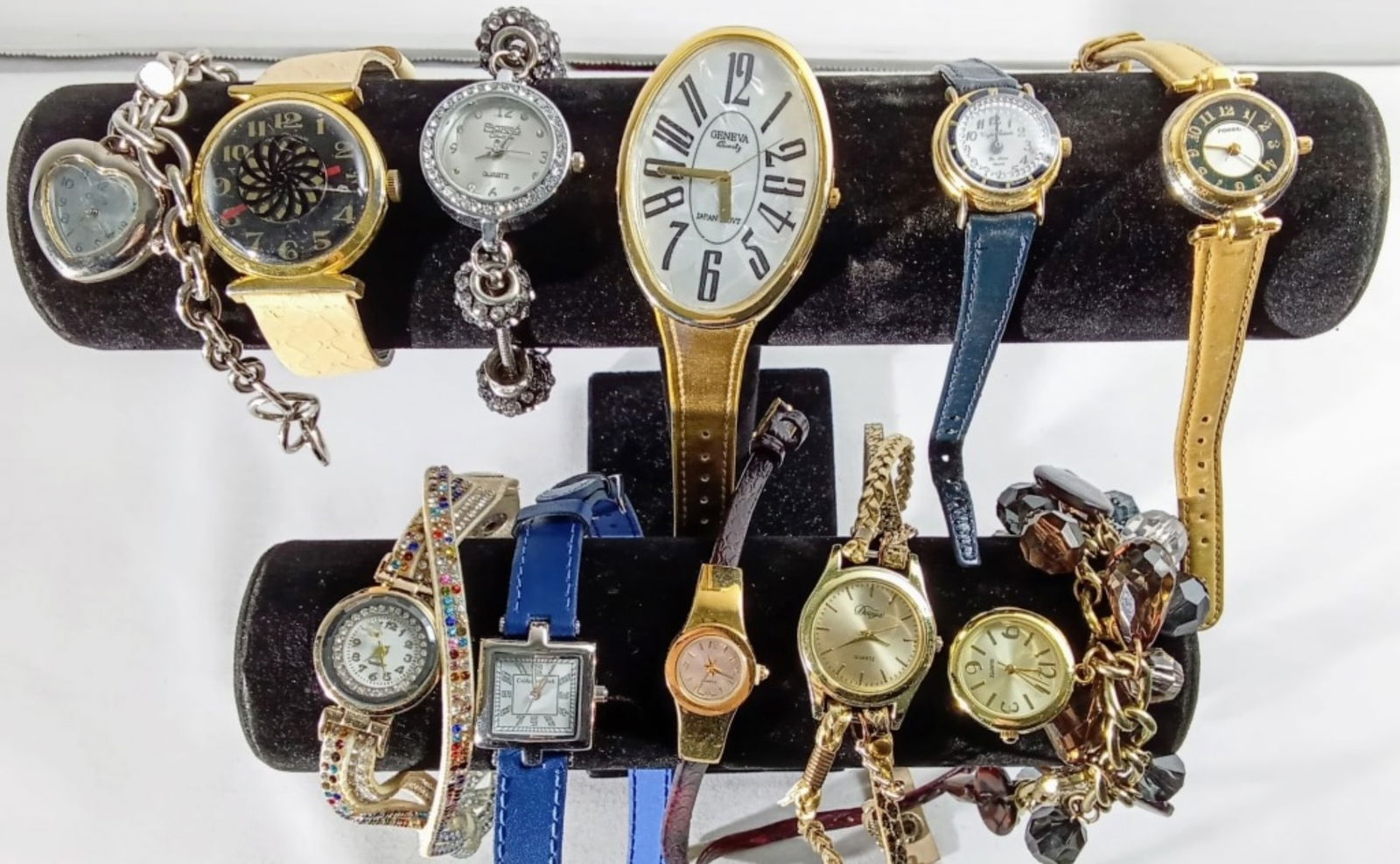 (10) MIXED LOT LADIES WATCHES: WATCHES ARE NOT VERIFIED, AUTHENTICATED, OR TESTED IN RUNNING CONDITION UNLESS SPECIFIED, INCLUDING (4) BELTS, (2) BRACELETS, (3) GOLD, (1) BLUE BAND, DUOYA, CUSTOMTINE, FOSSIL, GENEVA, & MORE