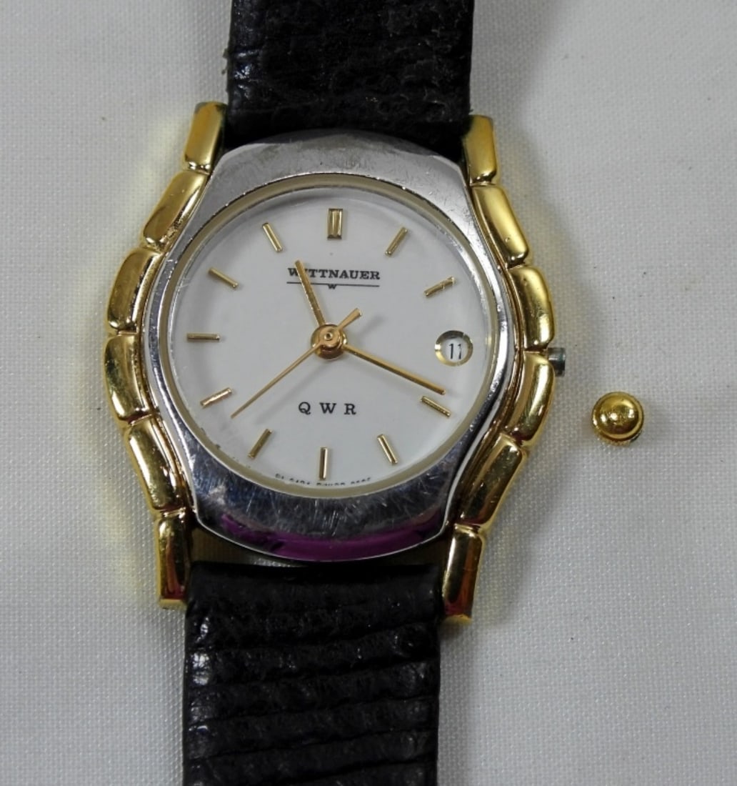 LEATHER BAND WITTNAUER WATCH: LEATHER BAND WITTNAUER WATCH, DIAL ON SIDE IS BROKEN, UNTESTED, WATCH MAY OR MAY NOT WORK, COULD BE USED FOR PARTS OR REPAIR