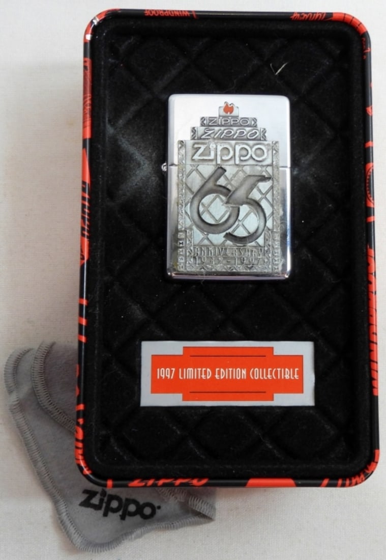 1997 SEALED 65TH ANNIVERSARY ZIPPO: 65TH ANNIVERSARY 1932-1997, IN ITS ORIGINAL TIN CASE, WITH CLEANING CLOTH, LIMITED EDITION