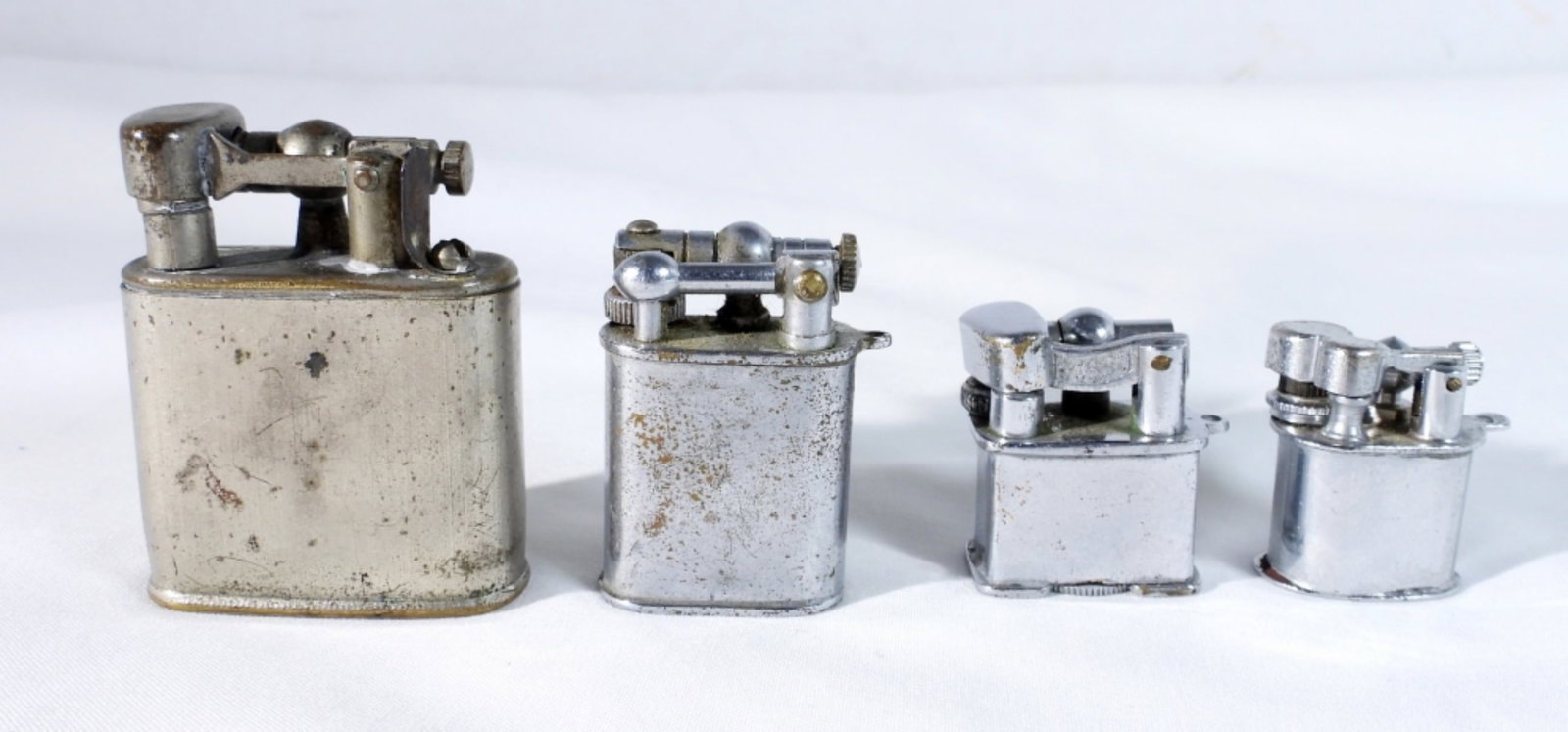 (4) VINTAGE EMPRESS MINITURE LIGHTERS: UNTESTED PRE-OWNED USED MINITURE LIGHTERS