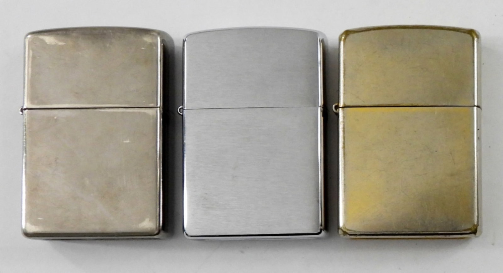 BRASS TONE 2003 ZIPPO LIGHTER & MORE: 2003 BRASS TONE ZIPPO LIGHTER FIRED. 2006 ZIPPO LIGHTER , FIRED.2007 ZIPPO LIGHTER, FIRED