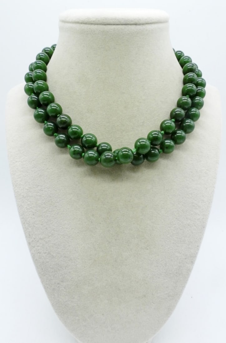 14K JADE BEADED NECKLACE: 14K YELLOW GOLD CLASP ON A 30" JADE BEADED NECKLACE. GENUINE JADE. HEAVY NECKLACE. (1.5 DWT / 14KG)