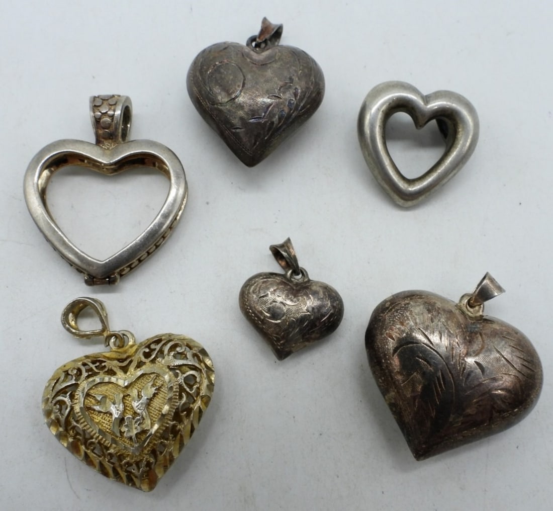 (7) STERLING HEART PENDANTS: SEVEN STERLING HEART PENDANTS. (26.3 DWT)