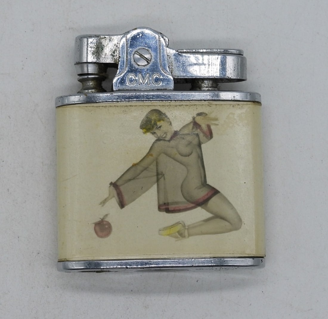 Pin Up Girl Vintage Lighter, Circa 1950's: Vintage Pin-up girl lighter. Different pin up photo on each side. Circa 1950s.