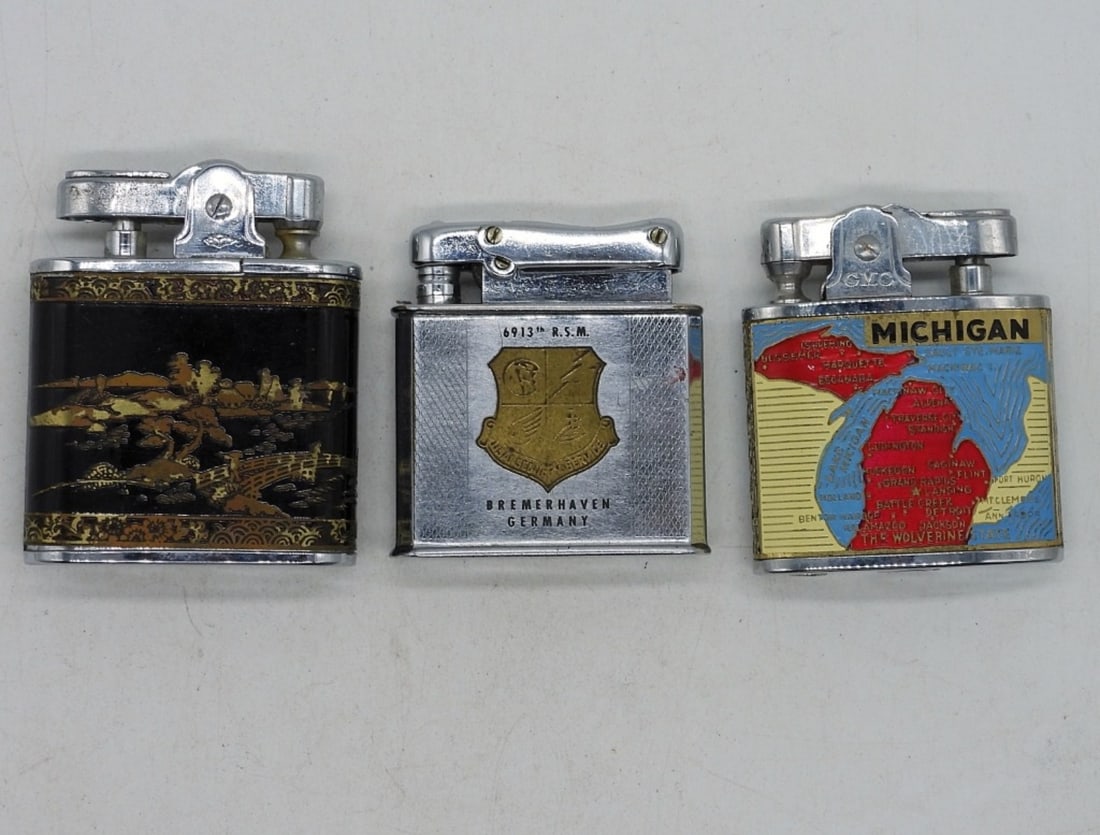 Vintage Destination Lighters: Three vintage destination lighters. Michigan, Asian Scene & Bremerhaven Germany (engraved F.P. McCue Jr).