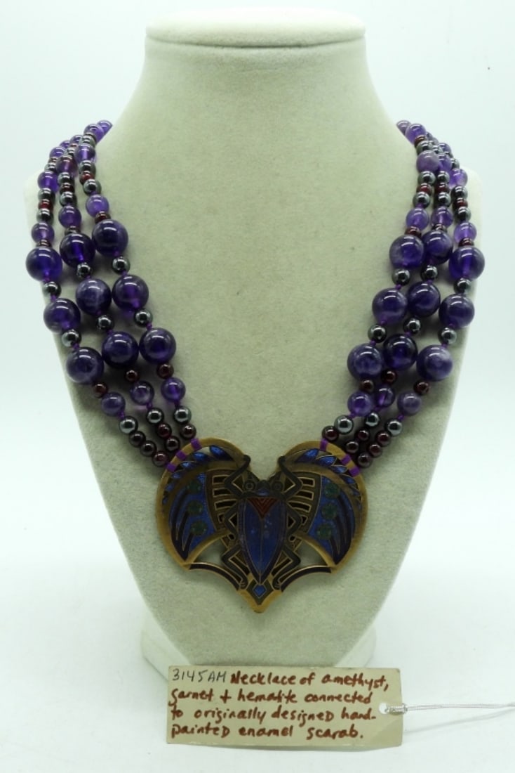 Sunya Currie Scarab Necklace Amethyst: 20" necklace of amethyst, garnet, and hematite, hand-painted enamel scarab