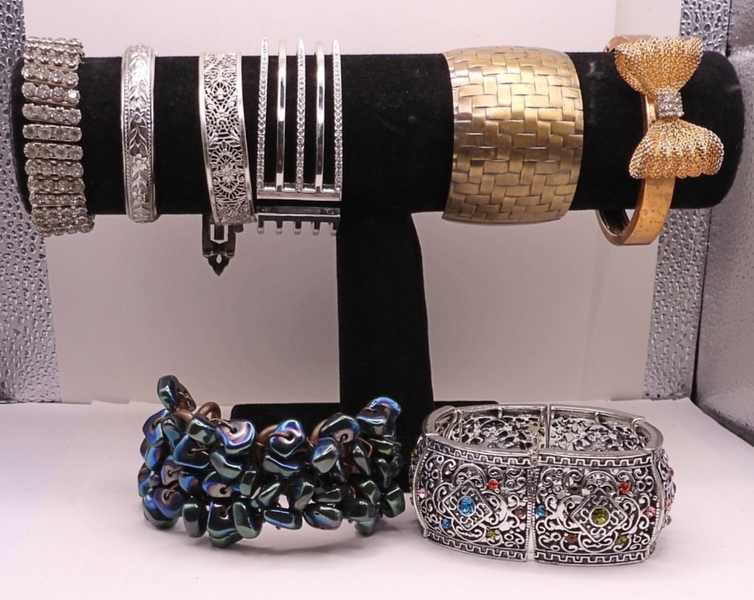 8 Cuff Bracelets: 1 Chunky Beaded Copper Toned, 4 Silver Toned 3 With Jewels, One Gold with Bow