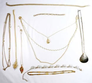 7 Gold Necklaces And 1 Bracelet