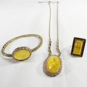 A Necklace, Bracelet, And Ring Set