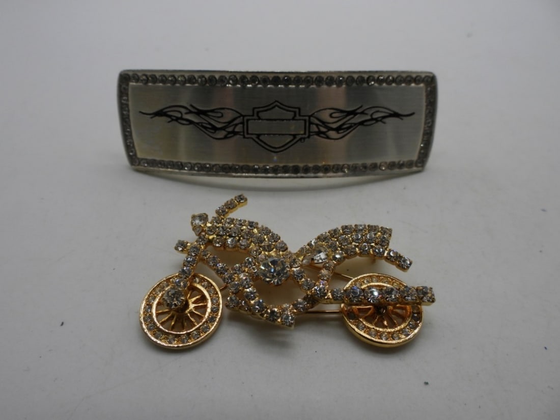 Harley Davidson Hair Clip And Brooch: The brooch is NOT Harley Davidson, but the wheels turn. Gold tone. The hair clip is silver-toned