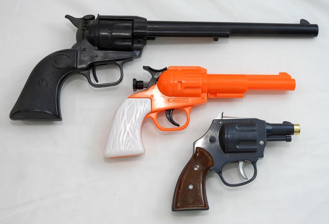 (3) Plastic Toy Clicking Pistols/Guns: Snub Nose cap gun, Haig western long piston and China orange click toy gun.