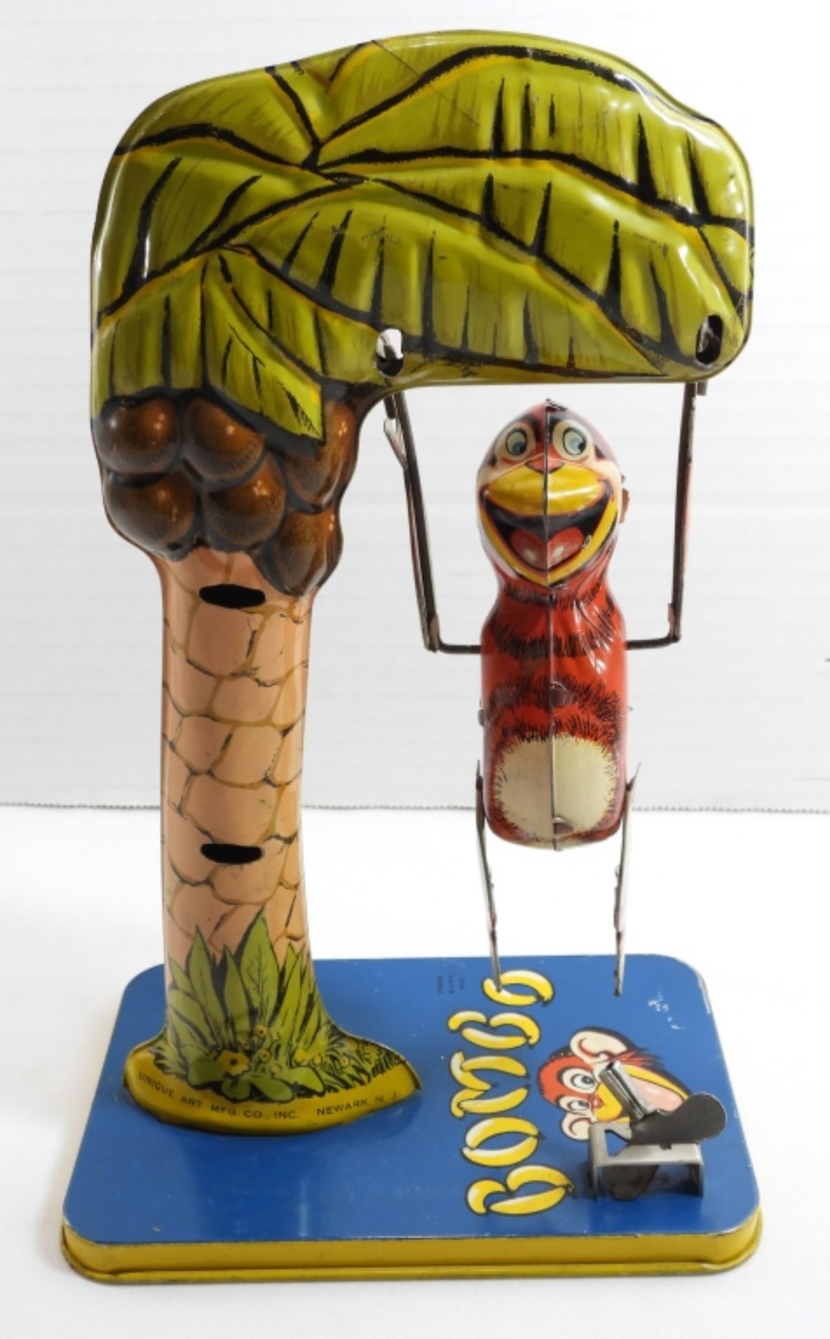 1940's Bombo Monkey Wind Up Toy: In good working condition. Comes with a small scratch at base. Does show some wear, overall all in fair to good condition, preowned.