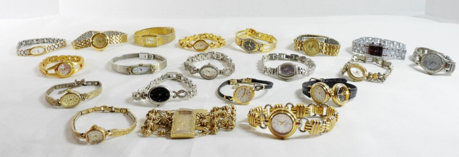 Mixed Lot Of 20 Women's Fashion Watches: Watches are not verified, authenticated, or tested in running condition unless specified. Mixed lot of 20 women's fashion watches, gold and silver-toned.