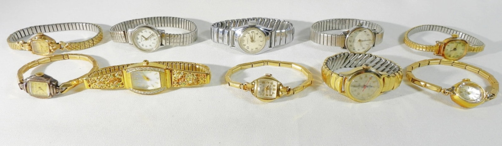 10 Women's Fashion Stretch Band Watches: 7- Gold-tone, 3 silver-tone, All different styles. Watches are not verified, authenticated, or tested in running condition unless specified.