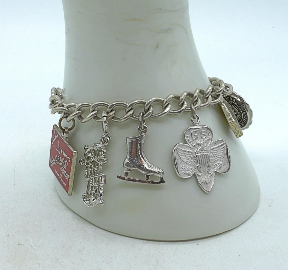 Vintage Sterling Charm Bracelet - 10 Charms: Vintage sterling charm bracelet with 10 charms. 6.5 inches. (24.5 dwt)