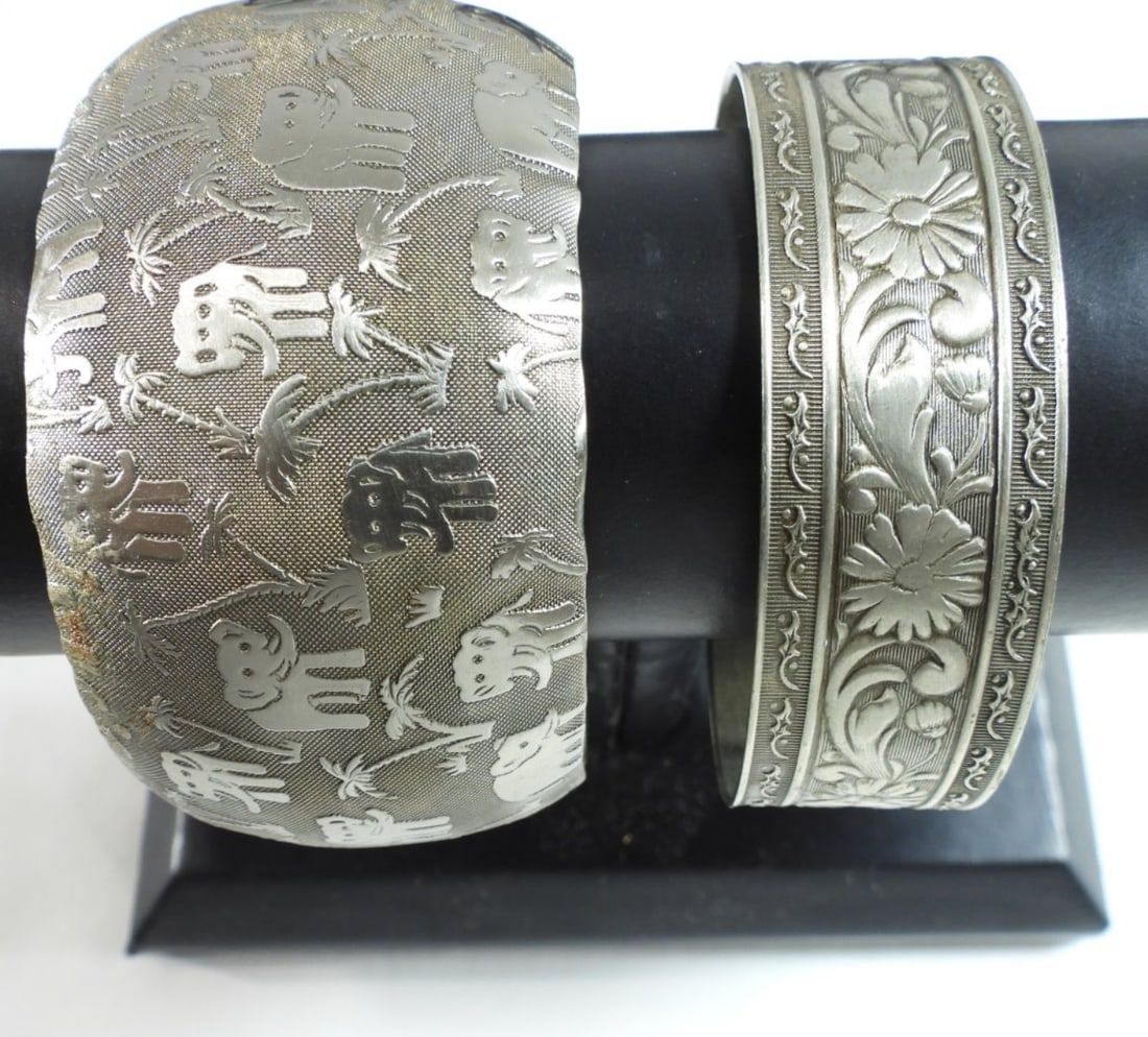 (2) Cuff Bracelets: (2) Silver-tone bracelets