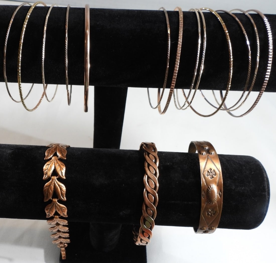 (16) Copper Color Bracelets: 1) Clasp, 2) cuff bracelets, and the rest are bangle style, very thin