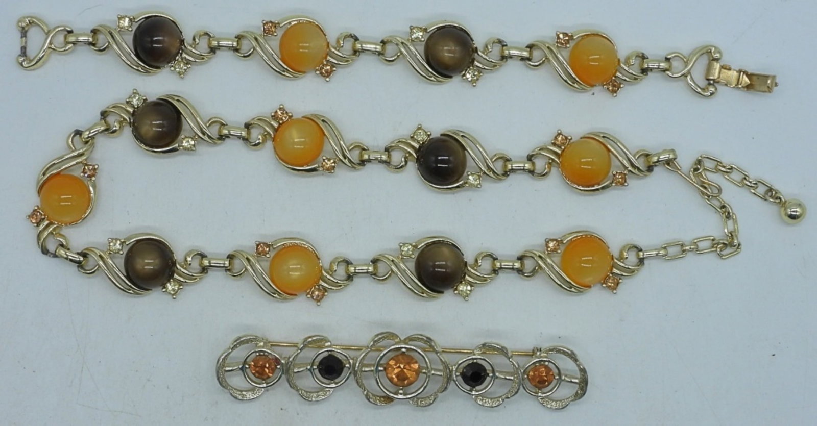 Matching Necklace And Bracelet: gold tone matching 14" bracelet, 30" necklace, and pin