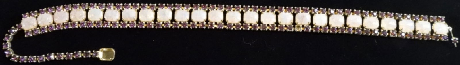 (1) Necklace: Gold tone with pink and purple stones. It is missing one stone as shown in photo. Also an other stone is loose.