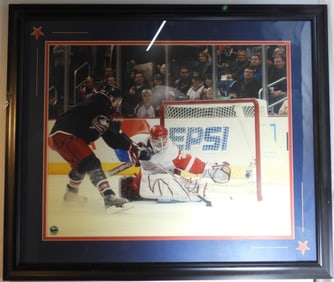 Large Photo Of Blue Jackets Against Red Wings