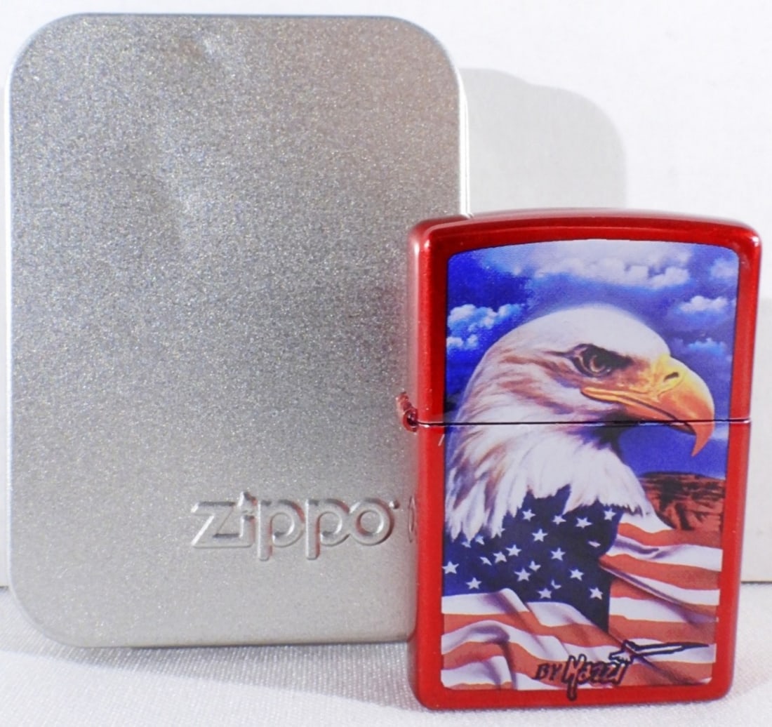 Unfired 2006 Mazzi Eagle With American Flag Zippo: Comes in a tin case. Unfired 2006