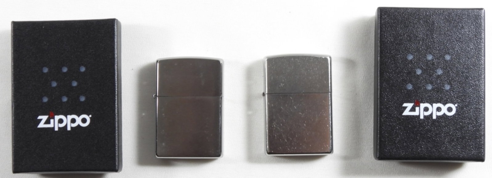 Sealed 2013 And 2016 Silver Plated Zippo: Sealed 2013 and 2016 silver-plated Zippo in box.