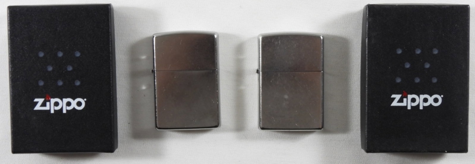 Sealed 2013 And 2016 Silver Plated Zippo: Sealed 2013 and 2016 silver-plated Zippo in box.