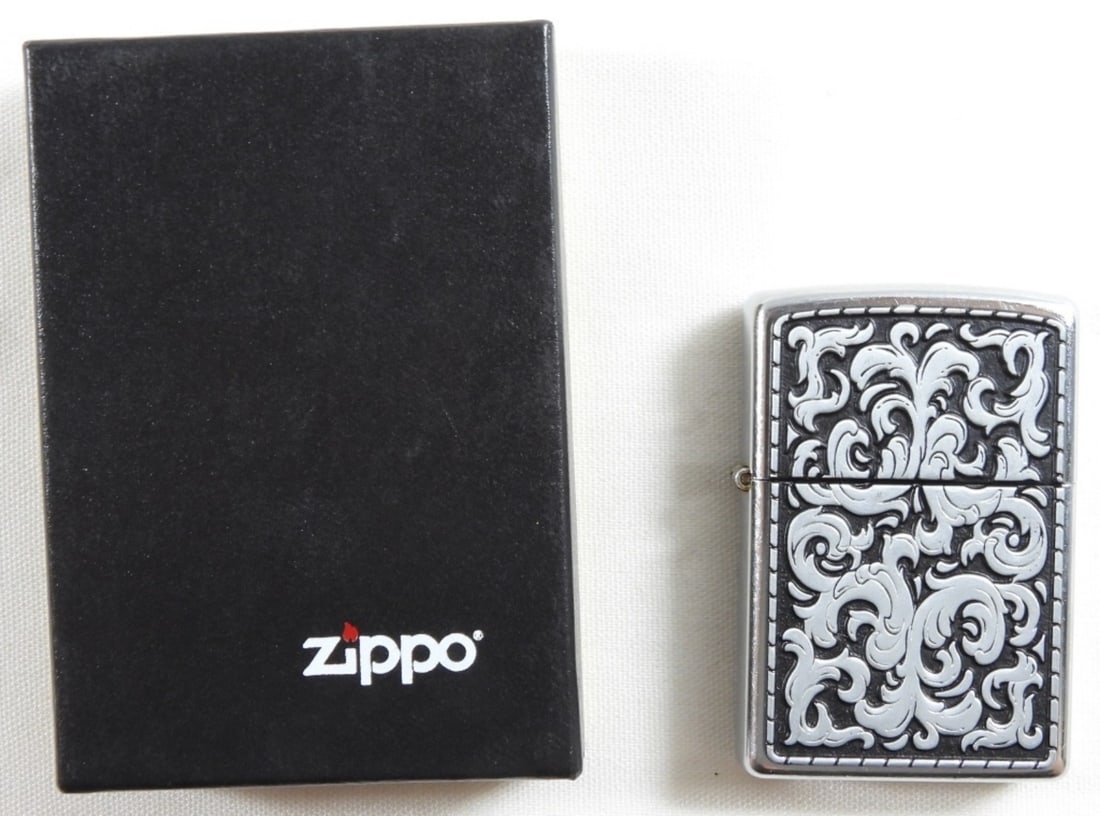 Unfired 2003 Marlboro Zippo: Unfired Vintage Zippo lighter 2003 Marlboro Storming Scroll Filigree chrome, in the box.