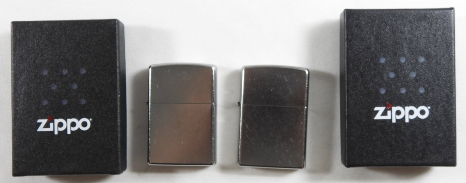Sealed 2014 And 2016 Silver-toned Zippos: Sealed 2014 And 2016 Silver-toned Zippo, in boxes.