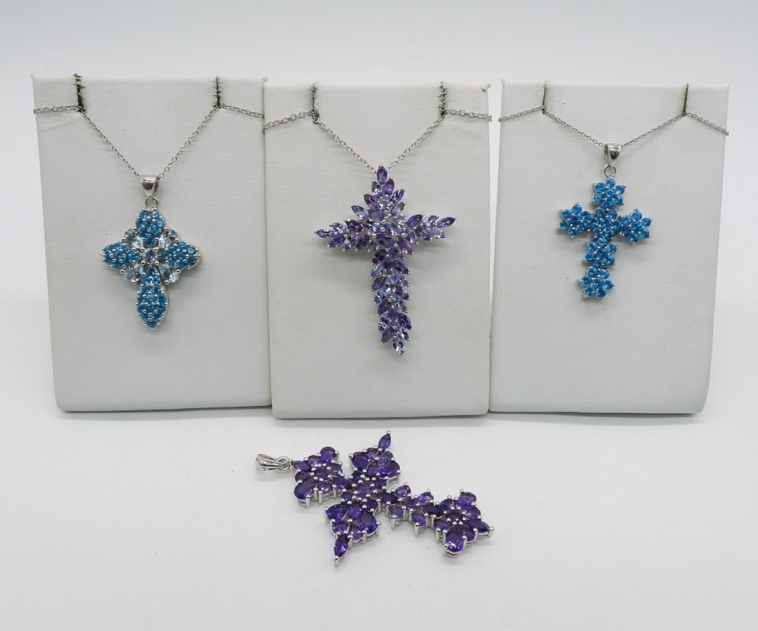 Cross Pendants 925 Swiss Topaz & Amethyst: Two sterling, Swiss blue topaz cross pendants. Two sterling amethyst cross pendants. Sterling chains are 18" & 24". (20.6 dwt)