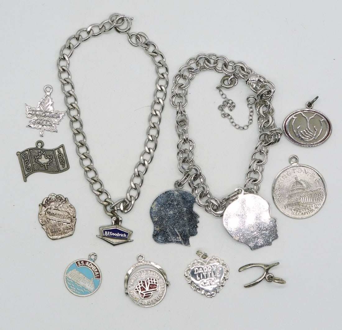 Sterling Charm Bracelets & 12 Charms: Two sterling charm bracelets with 12 total sterling charms. (25 dwt)
