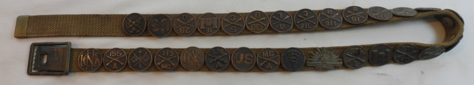 Collection Of WWI Collar Discs: 29 WWI U.S. collar discs and the Australian Rising Sun, all pinned to a belt, beautiful condition