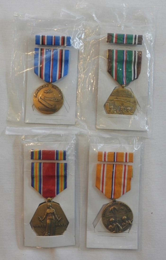 4 WWII Medals Still Sealed In Plastic: 4 medals for service during WWII sealed in plastic and all with ribbons