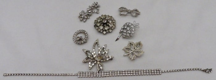 (7) Clear Rhinestone Brooches And A Necklace