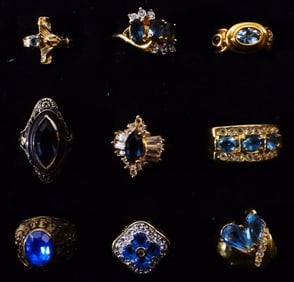 (9) Rings Gold-Toned With Blue Rhinestones