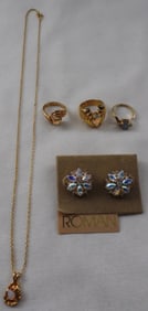 (1) Necklace (1) Pair Of Earrings (3) Rings