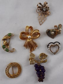 8 Gold-Tone Brooches