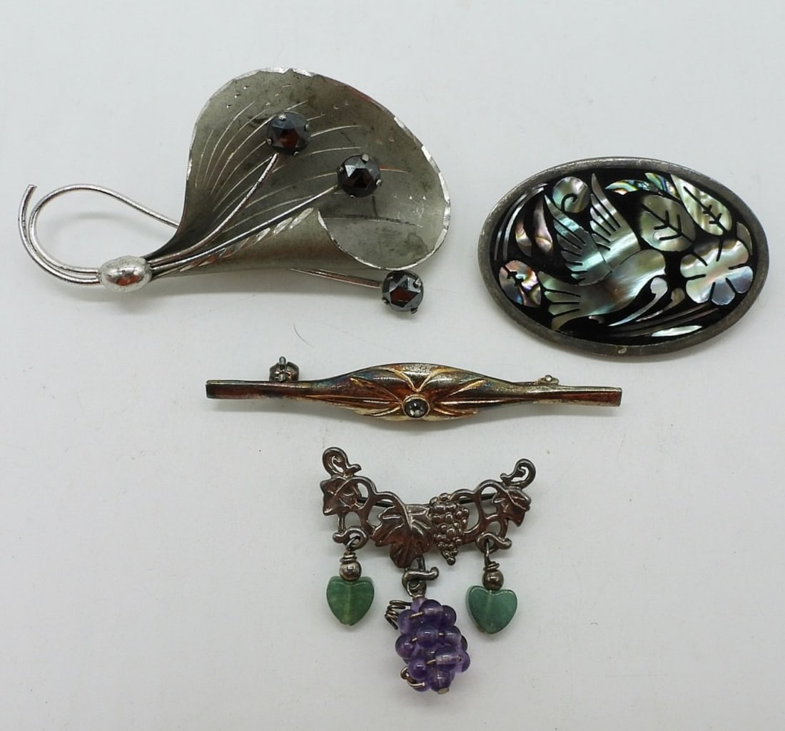 4 Sterling Brooches - Abalone & More: Four sterling brooches. Abalone, Black Gemstone. 1" -2.5". (17.8 dwt)