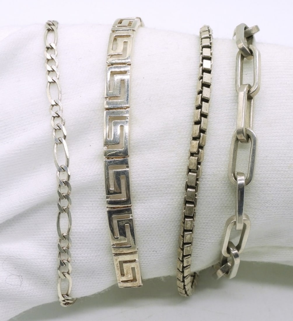 4 Sterling Chain Bracelets: Four sterling chain bracelets. 7" - 10". (24.2 dwt)