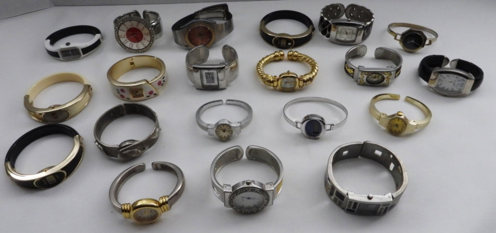 (20) Ladies Cuff Watches: Watches are not verified, authenticated, or tested in running condition unless specified. Including Studio, Finesse, and more
