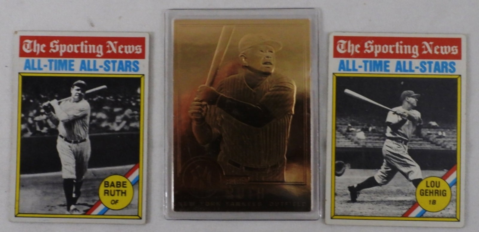 Two Babe Ruth Cards and One Lou Gehrig: Lou Gehrig has a bend in the top corner