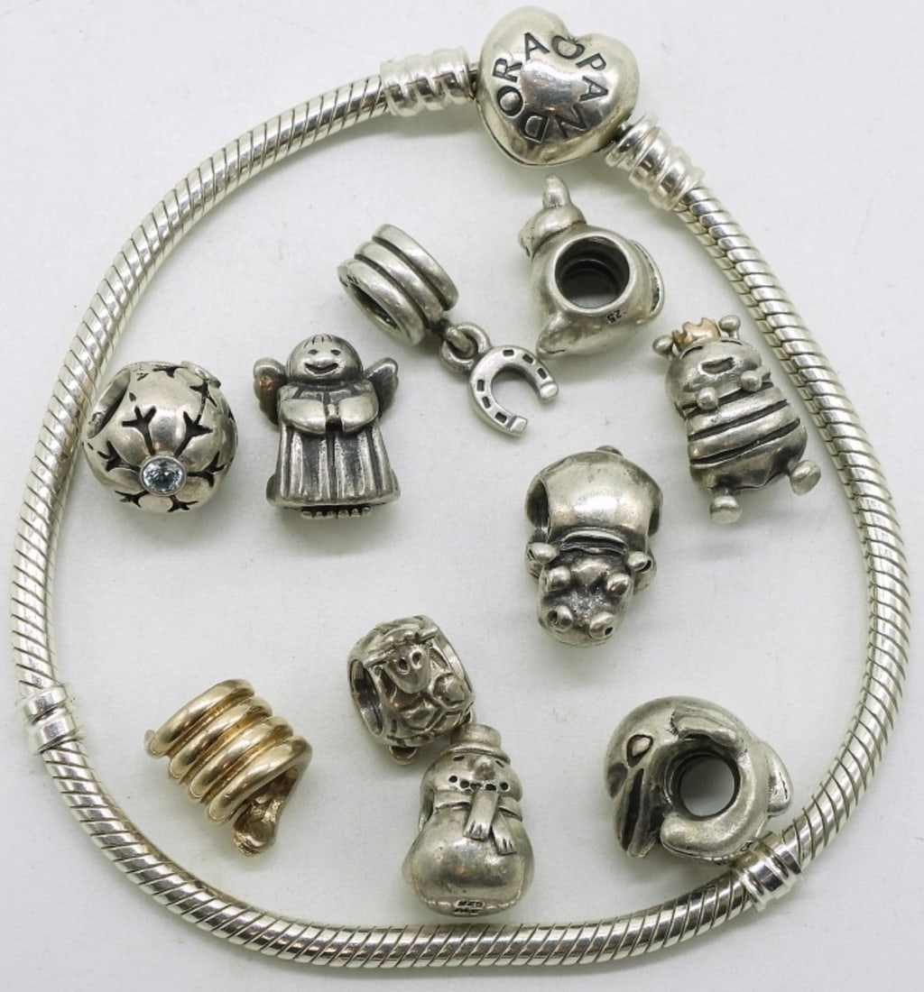 Pandora Bracelet with 10 sterling beads: Pandora heart clasp bracelet, 7" with 10 sterling beads (marked ALE 925). (32.7 dwt)