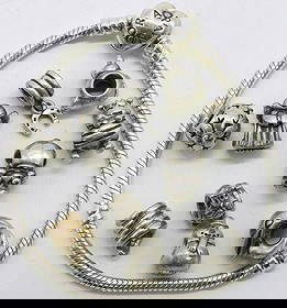 Pandora Bracelet with 10 sterling beads: Pandora heart clasp bracelet, 7" with 10 sterling beads (marked ALE 925). (32.7 dwt)