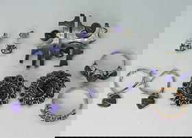 Amethyst & Charoite Sterling Jewelry: Two sterling rings, charoite & amethyst, sizes 7 & 8. 3 pair earrings, pierced & clip on. Sterling brooch, 1.5". (21.9 dwt)