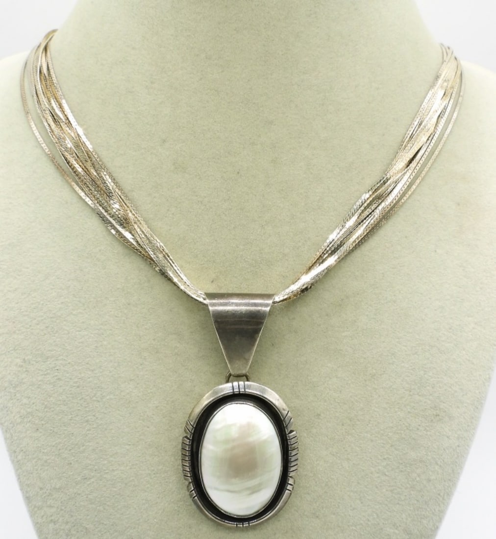 Multi Strand Mother of Pearl Necklace: Multi Strand Sterling Chain, 20" with a sterling mother of pearl pendant, 2.5". (28.7 dwt)