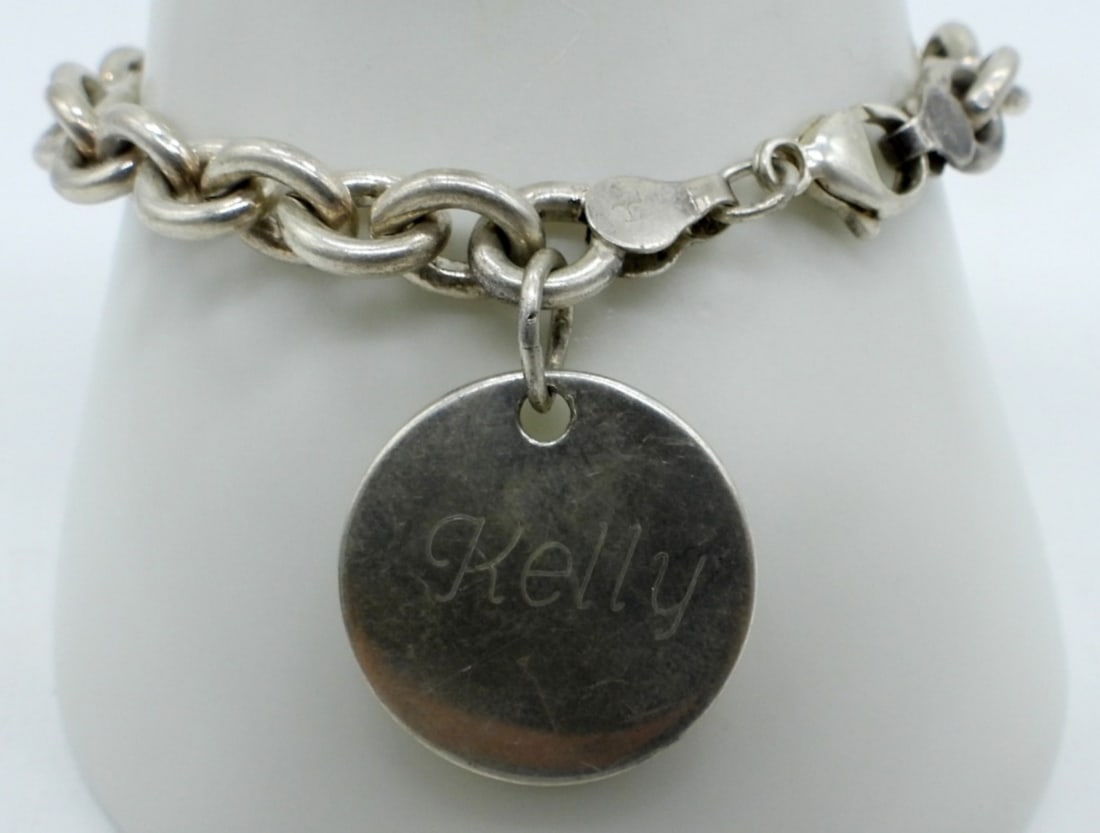Sterling Bracelet with Round Charm: Sterling bracelet with round charm, engraved "Kelly". 7". (19.7 DWT)