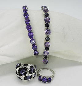 Amethyst Sterling Rings & Bracelets: Hinged sterling bangle bracelet, 8" and two tone amethyst bracelet 7". Two sterling rings, size 8. (34 dwt)